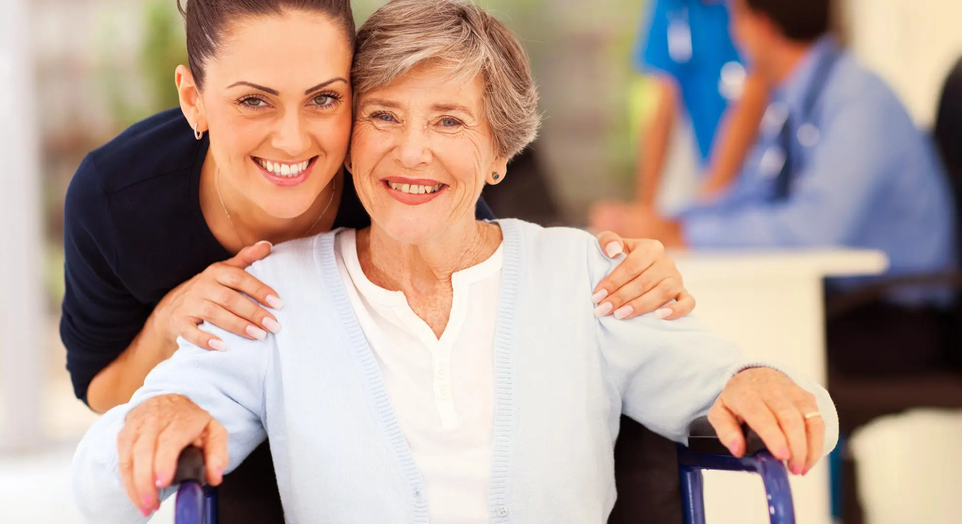 smiling caregiver and a women